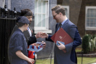 Prime Minister Keir Starmer buys poppy on the steps of No10