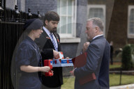 Prime Minister Keir Starmer buys poppy on the steps of No10
