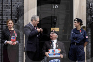 Prime Minister Keir Starmer buys poppy on the steps of No10
