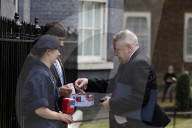 Prime Minister Keir Starmer buys poppy on the steps of No10