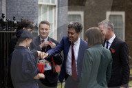 Prime Minister Keir Starmer buys poppy on the steps of No10
