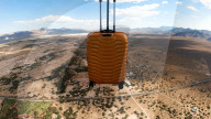 Suitcase dropped from space lands without a scratch