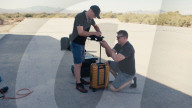 Suitcase dropped from space lands without a scratch