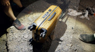 Suitcase dropped from space lands without a scratch
