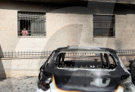 Cars burnt by Israeli settlers in West Bank