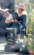 TVâ€™s original Catwoman Julie Newmar, 91, makes an extremely rare public appearance as she picks up an Uber Eats lunch delivery outside her LA home