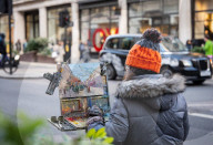 Christmas shopping in Regent Street, London, UK.