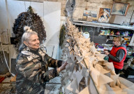 Volunteers weave winter camouflage nets for Ukraine Military