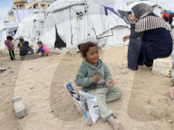 Displaced Palestinian families living in tent city