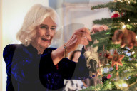Queen Camilla decorates a Christmas tree with children
