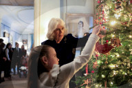 Queen Camilla decorates a Christmas tree with children