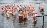 Members of the Serpentine Swimming Club participate in the annual Christmas Day morning Peter Pan Cup on the Serpentine, Hyde Park, London, Great Britain 
25th December 2024