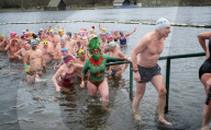 Members of the Serpentine Swimming Club participate in the annual Christmas Day morning Peter Pan Cup on the Serpentine, Hyde Park, London, Great Britain 
25th December 2024