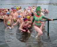 Members of the Serpentine Swimming Club participate in the annual Christmas Day morning Peter Pan Cup on the Serpentine, Hyde Park, London, Great Britain 
25th December 2024