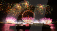 25th Anniversary of London’s New Year’s Eve fireworks display as seen from the RAF Memorial on the Embankment overlooking the river Thames towards the Coca-cola London Eye. 
31st December 2024