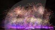 25th Anniversary of London’s New Year’s Eve fireworks display as seen from the RAF Memorial on the Embankment overlooking the river Thames towards the Coca-cola London Eye. 
31st December 2024