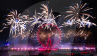 25th Anniversary of London’s New Year’s Eve fireworks display as seen from the RAF Memorial on the Embankment overlooking the river Thames towards the Coca-cola London Eye. 
31st December 2024