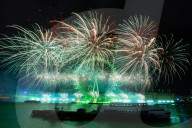 25th Anniversary of London’s New Year’s Eve fireworks display as seen from the RAF Memorial on the Embankment overlooking the river Thames towards the Coca-cola London Eye. 
31st December 2024