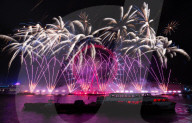 25th Anniversary of London’s New Year’s Eve fireworks display as seen from the RAF Memorial on the Embankment overlooking the river Thames towards the Coca-cola London Eye. 
31st December 2024