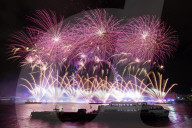 25th Anniversary of London’s New Year’s Eve fireworks display as seen from the RAF Memorial on the Embankment overlooking the river Thames towards the Coca-cola London Eye. 
31st December 2024