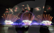 25th Anniversary of London’s New Year’s Eve fireworks display as seen from the RAF Memorial on the Embankment overlooking the river Thames towards the Coca-cola London Eye. 
31st December 2024
