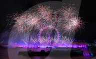25th Anniversary of London’s New Year’s Eve fireworks display as seen from the RAF Memorial on the Embankment overlooking the river Thames towards the Coca-cola London Eye. 
31st December 2024