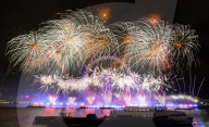 25th Anniversary of London’s New Year’s Eve fireworks display as seen from the RAF Memorial on the Embankment overlooking the river Thames towards the Coca-cola London Eye. 
31st December 2024