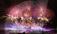 25th Anniversary of London’s New Year’s Eve fireworks display as seen from the RAF Memorial on the Embankment overlooking the river Thames towards the Coca-cola London Eye. 
31st December 2024