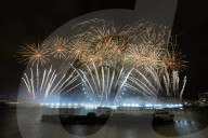 25th Anniversary of London’s New Year’s Eve fireworks display as seen from the RAF Memorial on the Embankment overlooking the river Thames towards the Coca-cola London Eye. 
31st December 2024