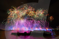 25th Anniversary of London’s New Year’s Eve fireworks display as seen from the RAF Memorial on the Embankment overlooking the river Thames towards the Coca-cola London Eye. 
31st December 2024