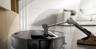 Robot vacuum cleaner has arm for picking up old socks and tissues