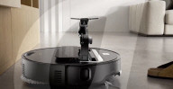 Robot vacuum cleaner has arm for picking up old socks and tissues