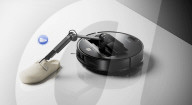 Robot vacuum cleaner has arm for picking up old socks and tissues