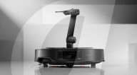 Robot vacuum cleaner has arm for picking up old socks and tissues