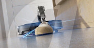 Robot vacuum cleaner has arm for picking up old socks and tissues
