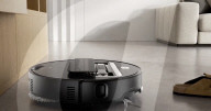 Robot vacuum cleaner has arm for picking up old socks and tissues