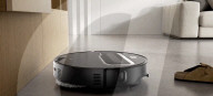 Robot vacuum cleaner has arm for picking up old socks and tissues
