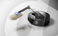 Robot vacuum cleaner has arm for picking up old socks and tissues
