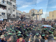 Palestinians view handover of Israeli hostages to ICRC
