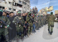 Palestinians view handover of Israeli hostages to ICRC