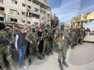 Palestinians view handover of Israeli hostages to ICRC