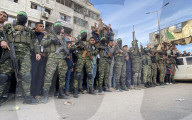 Palestinians view handover of Israeli hostages to ICRC