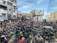 Palestinians view handover of Israeli hostages to ICRC