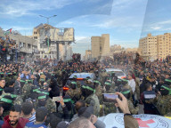 Palestinians view handover of Israeli hostages to ICRC