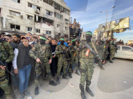 Palestinians view handover of Israeli hostages to ICRC