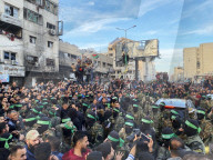 Palestinians view handover of Israeli hostages to ICRC