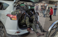 Palestinians view handover of Israeli hostages to ICRC