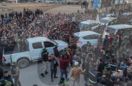 Palestinians view handover of Israeli hostages to ICRC