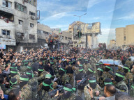 Palestinians view handover of Israeli hostages to ICRC