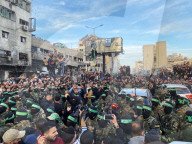 Palestinians view handover of Israeli hostages to ICRC